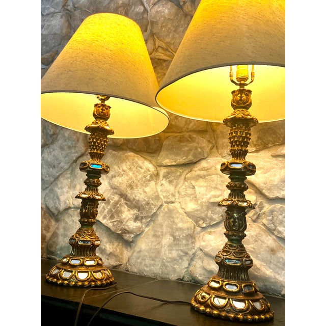A pair of 1920s Spanish-style candlestick lamps with 43 individual mirror insets. Measurements: Overall Height: 34.5"H...
