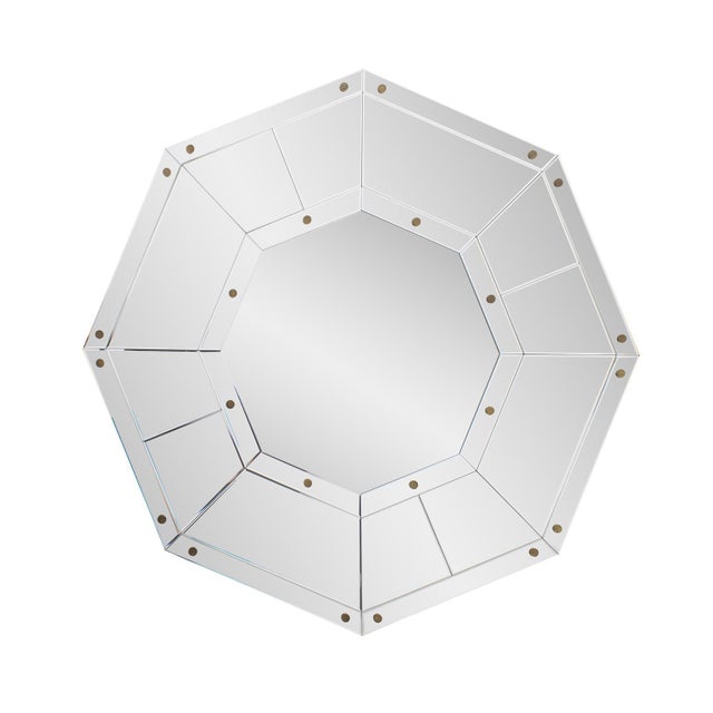 The Octet Mirror has a unique shape and design featuring multiple beveled mirror-on-mirror pieces that create a...