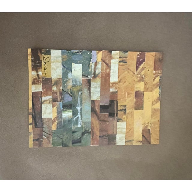 An original mixed-media collage composed of carefully arranged paper fragments in a sophisticated palette of warm ochre,...