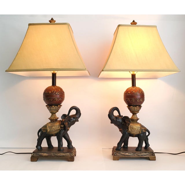 Offering a RESTORED pair of vintage Elephant Table Lamps in the style of Maitland Smith, made of heavy composite resin,...