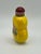 The pretty yellow double gourd shaped bottle is decorated with a two legged insect on both sides. I suppose it is an...