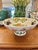 This large pedestal ceramic compote is from Portmeirion in the Pomona Fruit pattern. It is a piece that is so versatile…a...