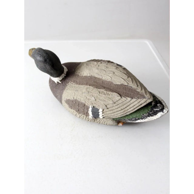 This is a vintage G&H duck decoy. The American crafted mallard drake decoy is cast plastic with nice detailing and painted...