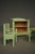 A rare and charming set of four pieces of miniature furniture or toy furniture. Painted plywood constructions in the style...