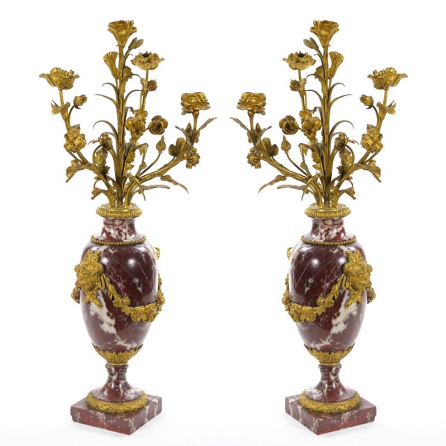 Antique Louis XVI style gilt bronze mounted and white-veined red marble pair of candelabra, French, circa 1885. Each...