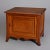 Vintage pair of maple box form single door side stands with raised panels, shaped skirt and raised on tapered and flared...