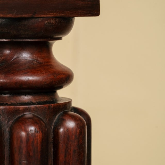 Pair of mahogany pedestals with a dark finish. These Louis XVI pedestals are typical of the early 20th century. They...