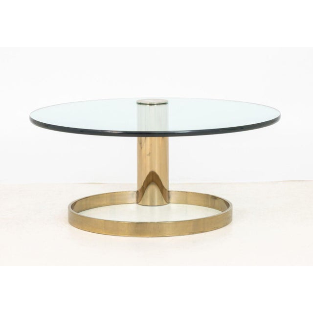 Modern Circular Glass Top Gilt Metal Coffee Table. 16" H x 36" Diameter. Provenance: From a Long Island, New York Estate.