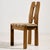 Solid oak dining chair with sculptural backrest and comfortable textile upholstery from the 1980s. with some surface...