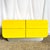 A striking postmodern dresser defined by its sculptural waterfall silhouette and high-gloss yellow laminate finish. The...