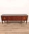Wooden sideboard with five inlaid doors and a stained glass top. Designed by Paolo Buffa. It features an embossed stamp...