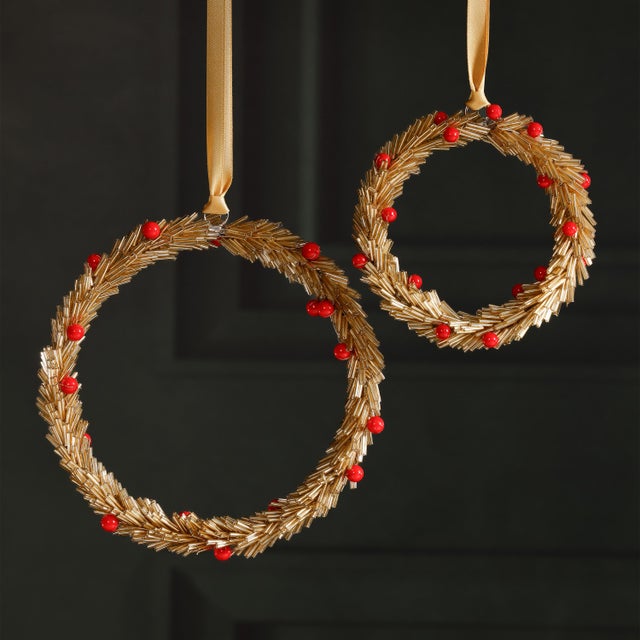 Celebrate the season with these festive beaded ornaments, thoughtfully crafted from iron and glass in either star or round...