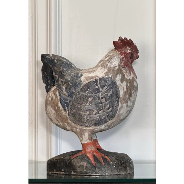 A hand painted distressed finish adorns this colorful hand carved rustic European style rooster. Crafted from solid wood...