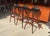 In very good used condition, stable and sound in construction with minor age related signs of wear. Iconic stools in teak...