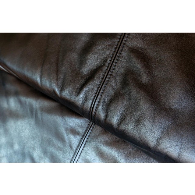 A strikingly attractive, rare and super-stylish postmodern black leather chaise longue in lovely vintage condition. Sold...
