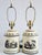 Vintage Italian made French inspired tole painted tea caddy table lamps. The lamps feature French toile style motifs on...