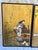 A pair of antique Japanese hand painted landscape scenes on a woven media. The scene depicts women weaving textiles among...
