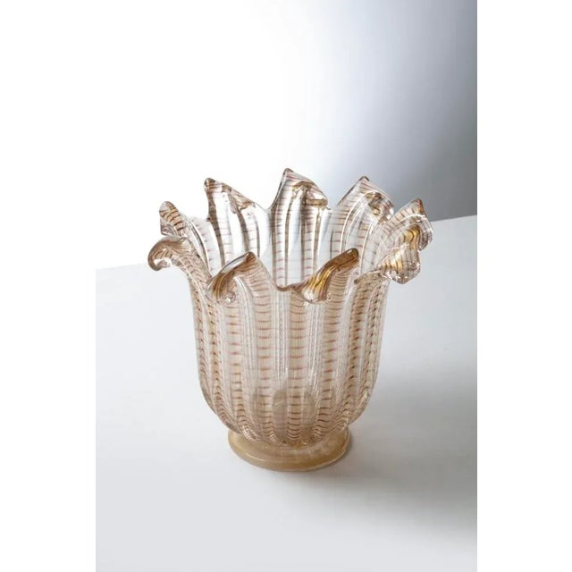 Murano vase in blown glass from the "zebrato" series, with a ribbed hemispherical body of transparent glass, gold and...