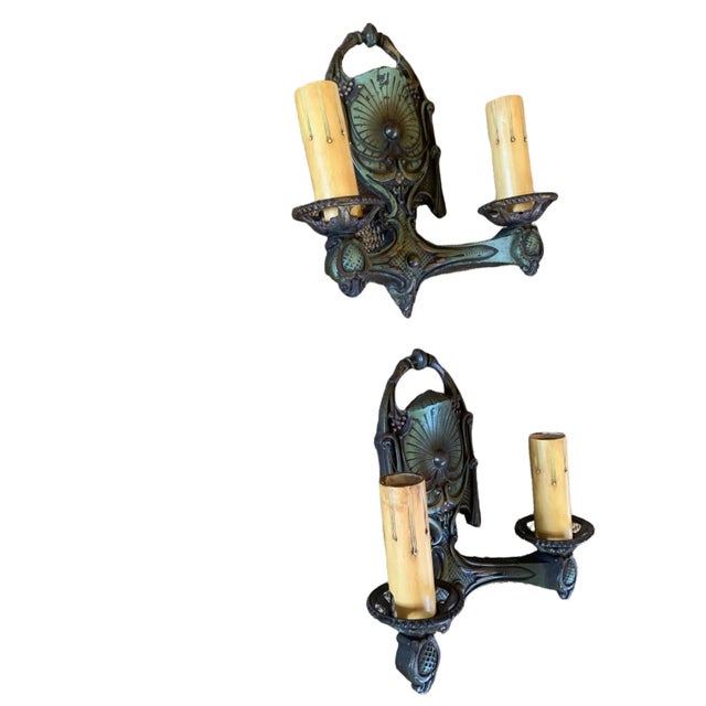 Perfect Architectural Digest green! These wonderful cast iron sconces display variation of approximately 3 shadings of...