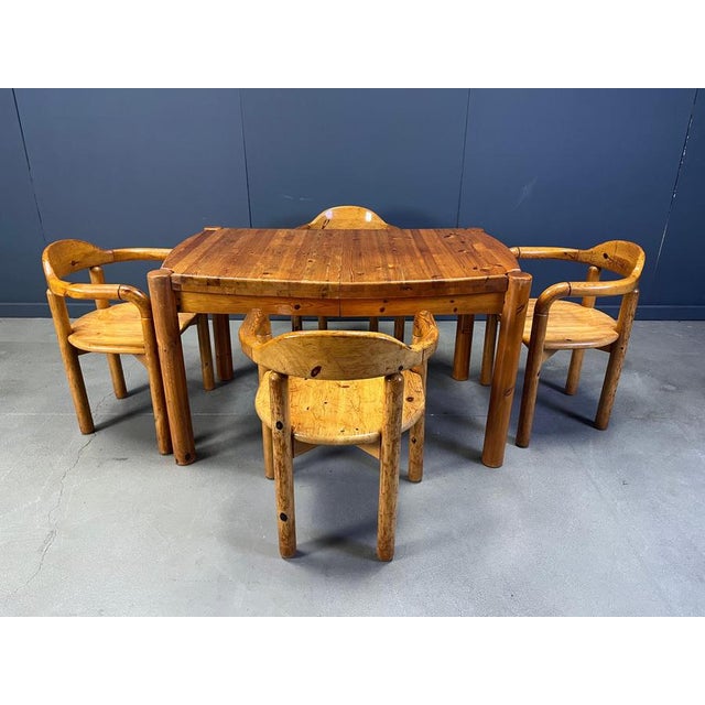Danish dining set consisting of 4 elegant pine wood dining chairs with armrests and a 4 leghged pine wood dining table....