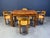 Danish dining set consisting of 4 elegant pine wood dining chairs with armrests and a 4 leghged pine wood dining table....