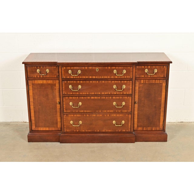 A gorgeous Georgian or Chippendale style sideboard, credenza, buffet, or bar cabinet By Councill Furniture USA, Late 20th...