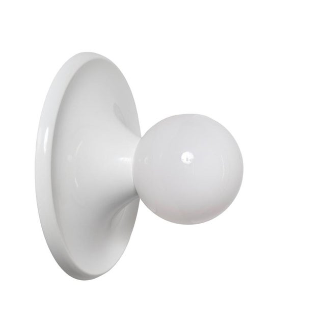 Incredibly rare first edition of the famous "light ball" applique by castiglioni in white metal and opal glass. This...