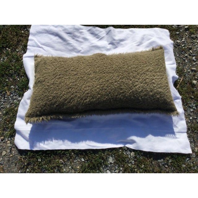 A beautiful alpaca pillow it has a Mossy look with raw edges it is a beautiful piece that will fit perfect in any home...