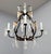 Made by Mario Lighting Inc Iron Chandelier With Rock Crystals. 4 Light Candelabra Sockets. Dark Brown Color Finish With...