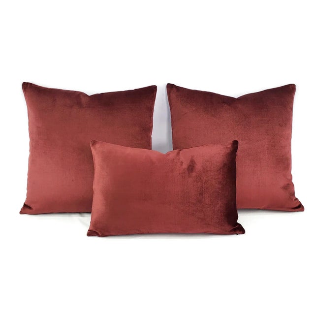This pillow features a stunning velvet in a rich burgundy color. The velvet is soft to the touch and durable. Bring this...