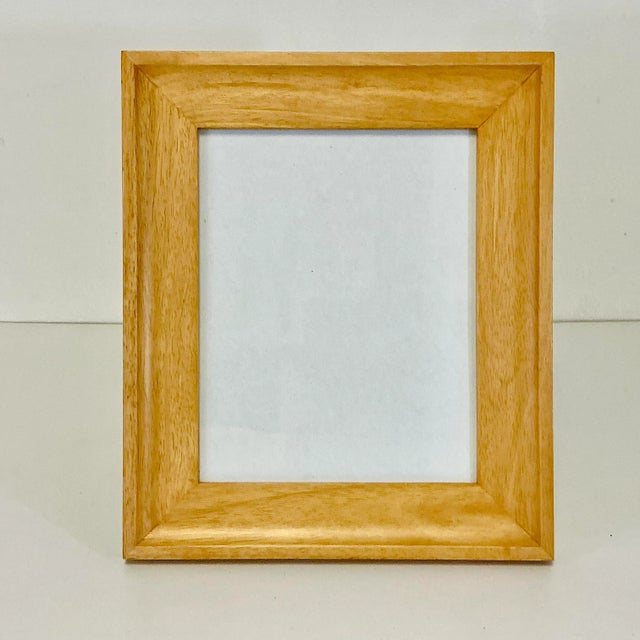 A lovely Fruitwood wide Picture Frame to enhance a favorite photograph. The wood is finished in a clear natural color. The...