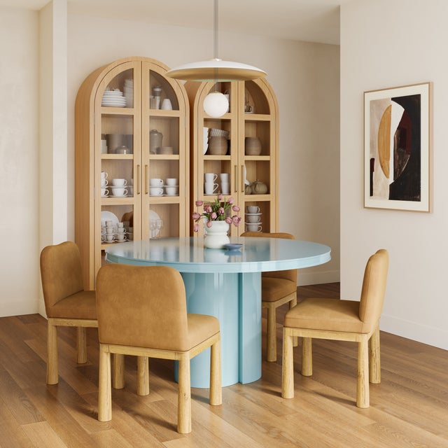 The Elora Lacquer Round Dining Table combines contemporary design with effortless elegance, featuring a sleek lacquer...