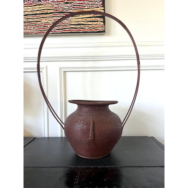 An oversize Japanese Ikebana Hanakago basket) handwoven with bamboo and rattan by Tokōsai (a bamboo artist active in the...