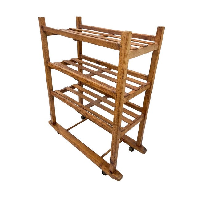 Perfectly weathered 100 year old cobblers rack (some say bakers, I say cobblers) with original all metal casters....