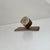 Small and stylish desk sculpture or paperweight. Despite its smaller size it is rather heavy. It was made in Scandinavia...