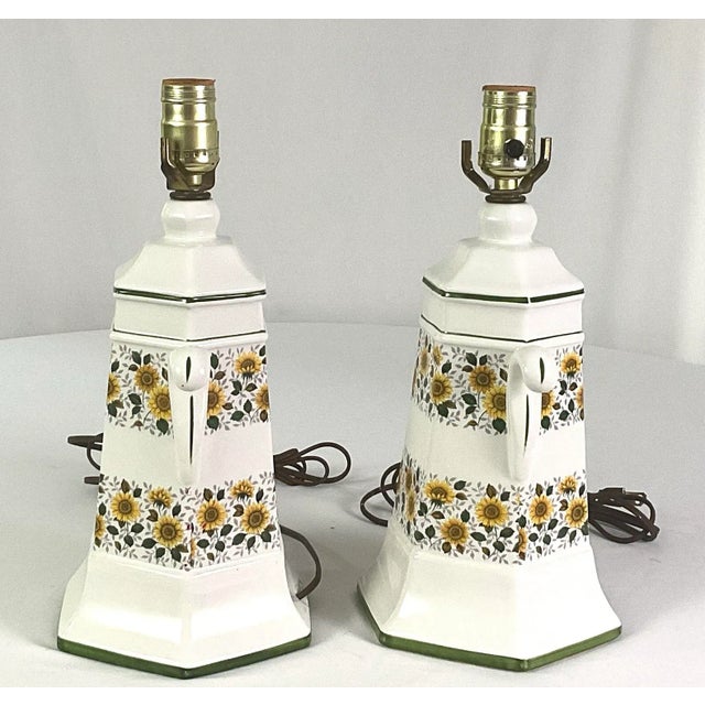 Unique and rare, white ceramic mid-century, modern table lamps, with sunflower chintz bands, and green trim Overall height...