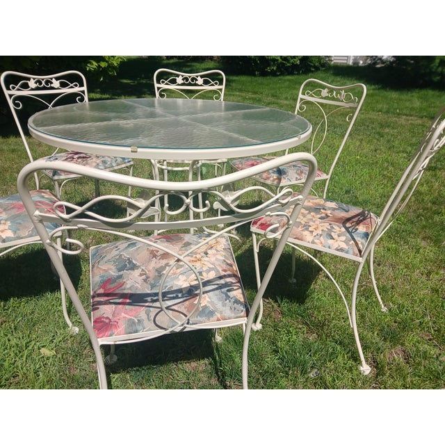 Vintage cream wrought iron patio dining set. In nearly perfect condition with no rust. Very high quality. Includes six (6)...