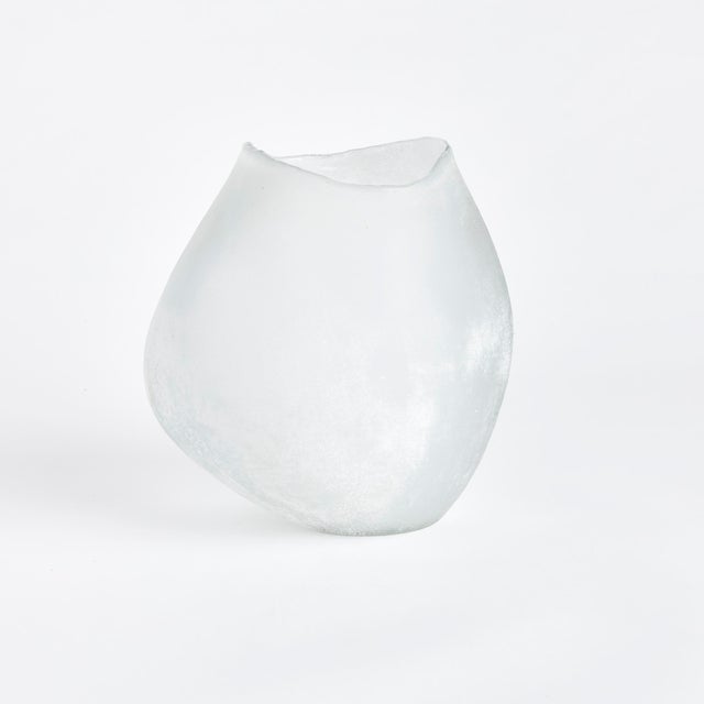 Natureinspired, this hand blown glass vase has a bulbous shape and melted edge rim detail. The frosted glass only adds to...