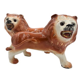Pair of Staffordshire Striding Lions For Sale