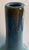 A striking monumental Mid-Century Modern studio pottery vase featuring a graceful bottle-form silhouette with a rich blue-...