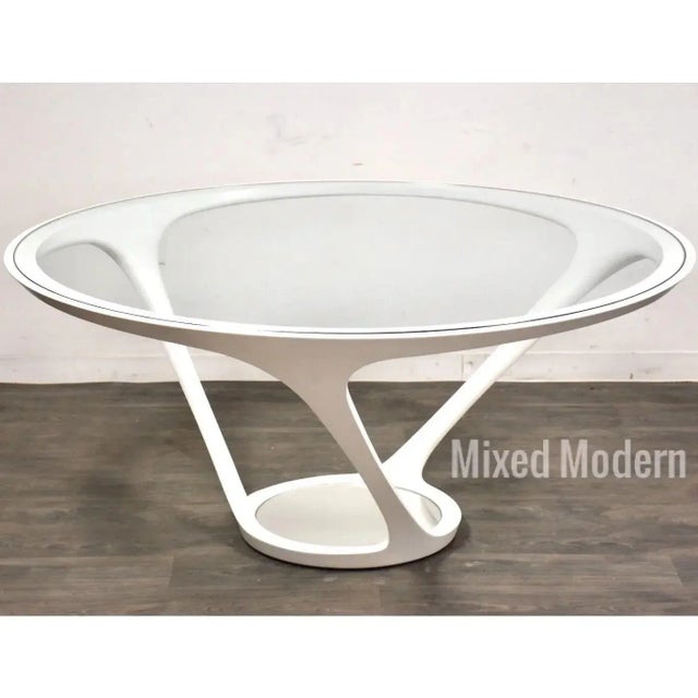 A rare award winning modern round glass dining table with a custom powder coated white steel base designed by Ora Ito for...