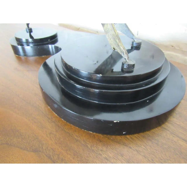 A pair of dancing figures are featured in this vintage table-top sculpture. A heavy plastic base with velvet on its bottom...