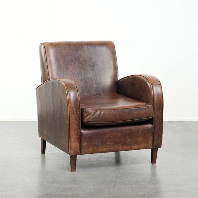 This fine sheepskin armchair features a timeless design with a soft, rounded shape and beautiful warm colors, and is...