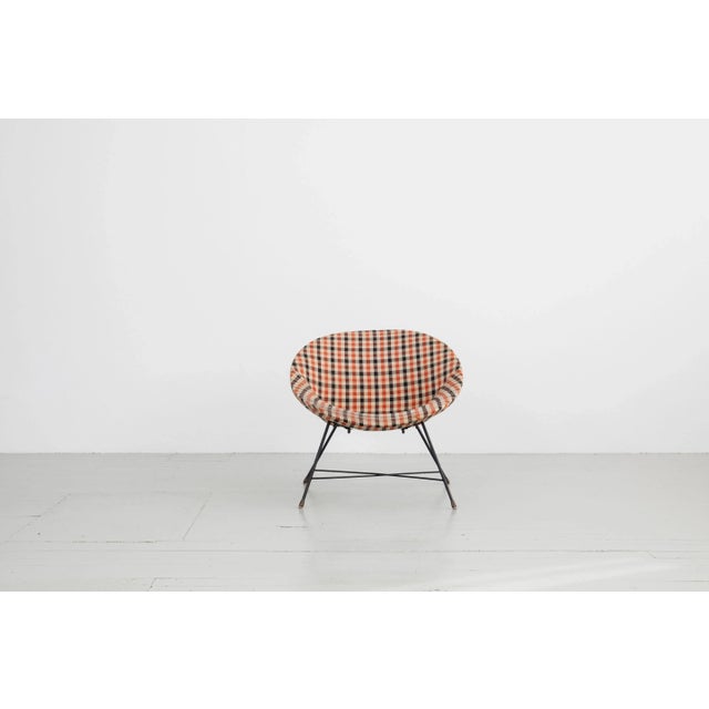 This playful armchair was designed in the 50s in italy by Augusto Bozzi and manufactured by Saporiti and it brings the...