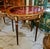 Showcase your treasured collectibles in timeless French elegance with this exquisite Louis XVI oval display side table....