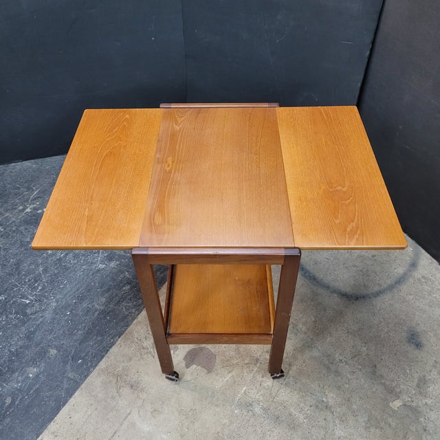 This fun 1960s English Tea Trolley With Lift Up Sides (36" wide when opened) is utilitarian and fits that vintage style...