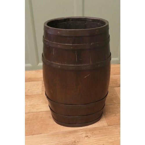 A Large Oak and Brass Barrel Stick Stand This good looking piece originated as a 19th Century slightly oval Rum Barrel, it...