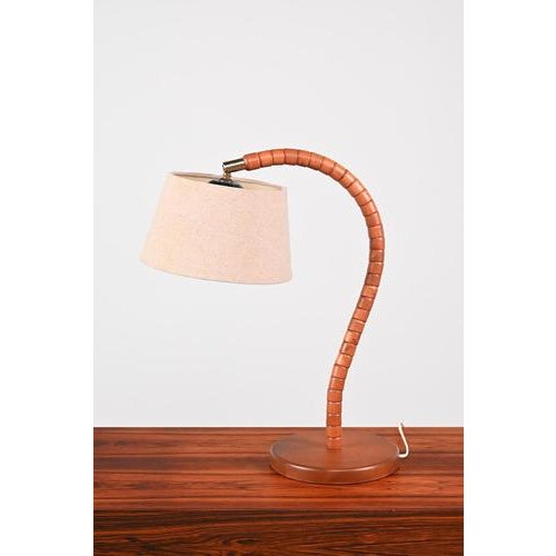 Markslöjd table lamp made in the sixties in kinna, sweden. The lamp is made of beech wood, brass and bakelite. The new...