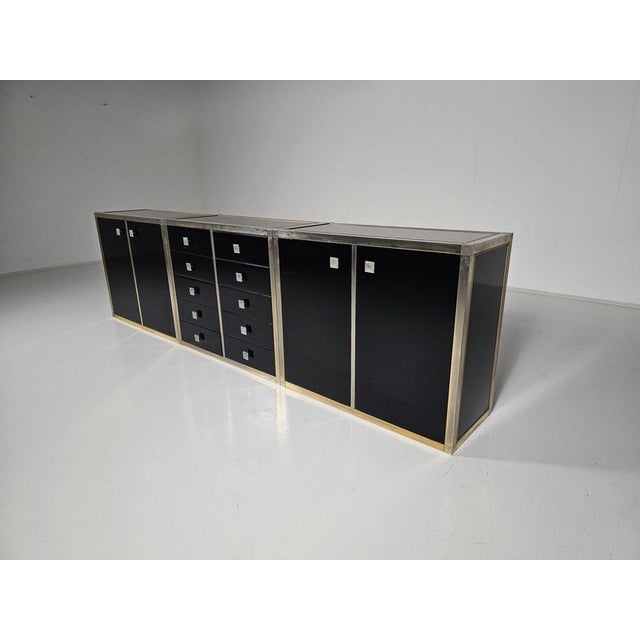 Stunning sideboard designed by Renato Zevi in the 1970s. It can also be separated to make smaller cabinets and a chest of...