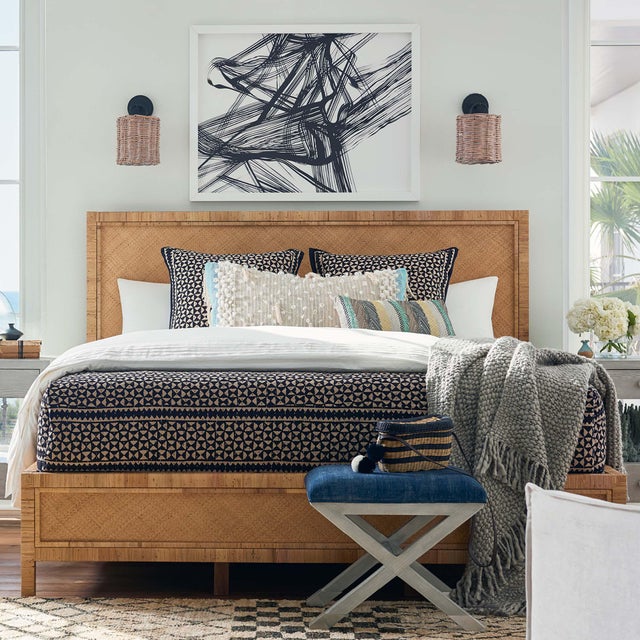 An intricate handwoven rattan shade is the focal point of this unique coastal Nantucket sconce. The basket shade is...